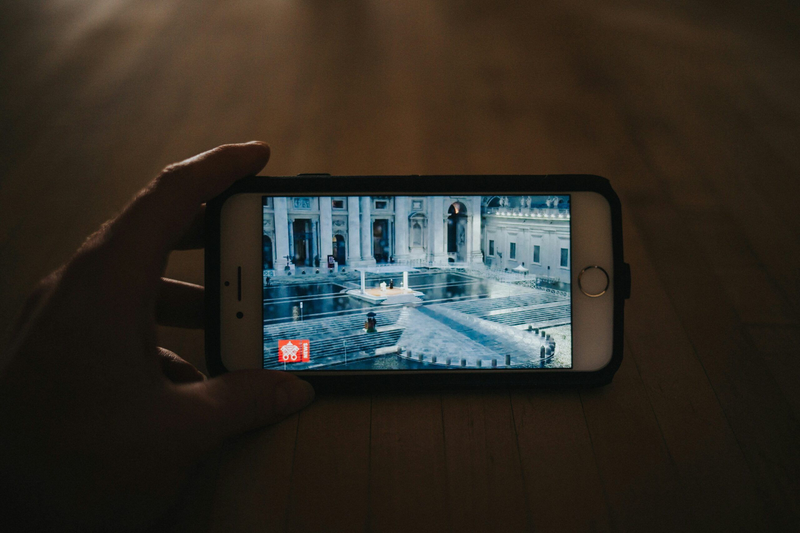Smartphone displaying a live stream of a building.