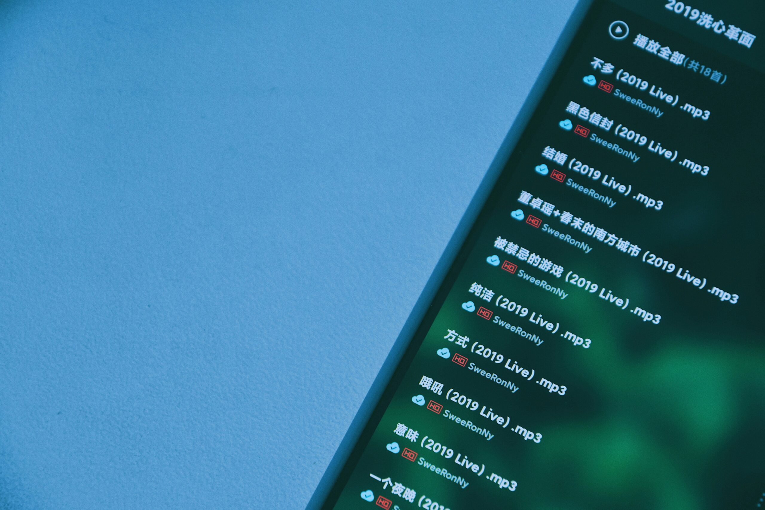 Mobile app interface displaying a list of songs. Relevant to music app marketing.