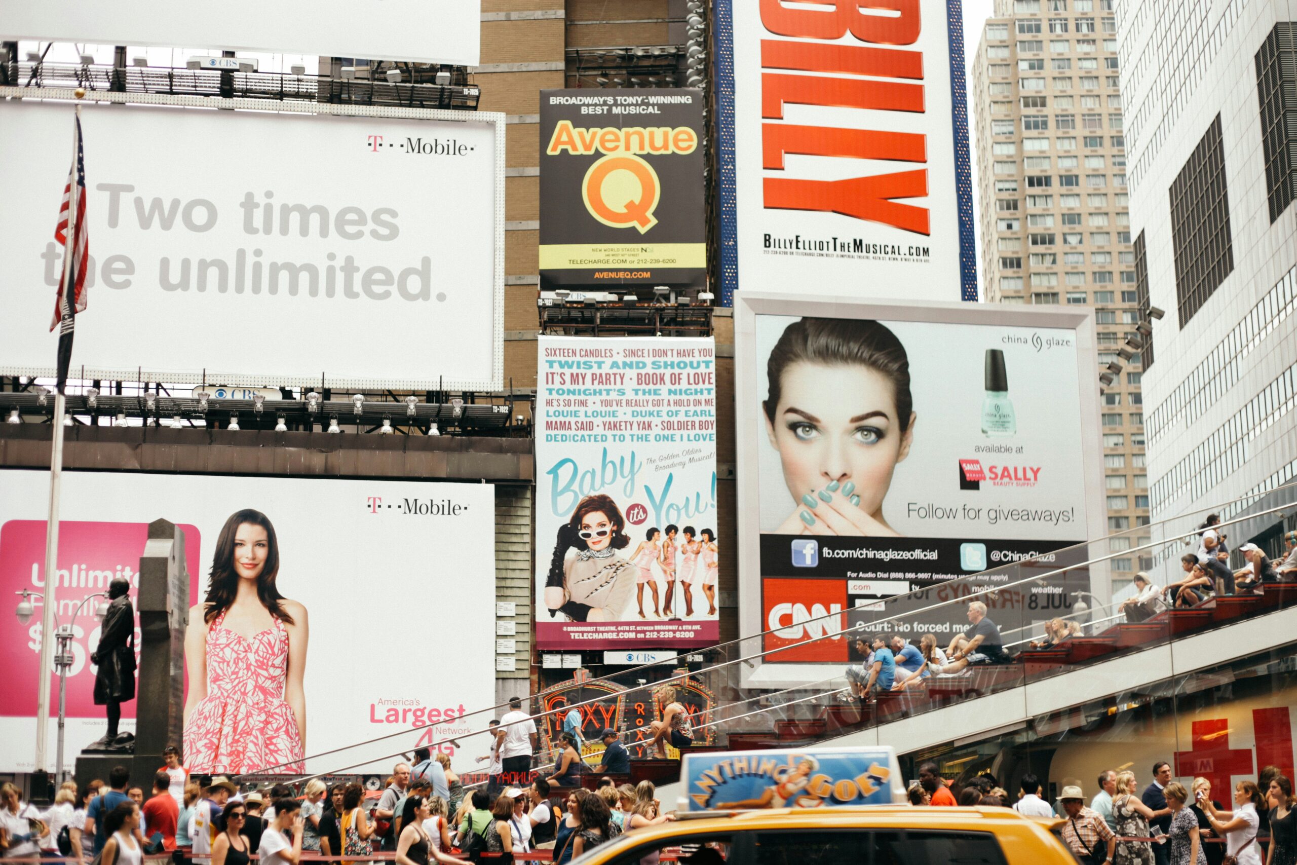 Times Square in New York City with billboards and people.