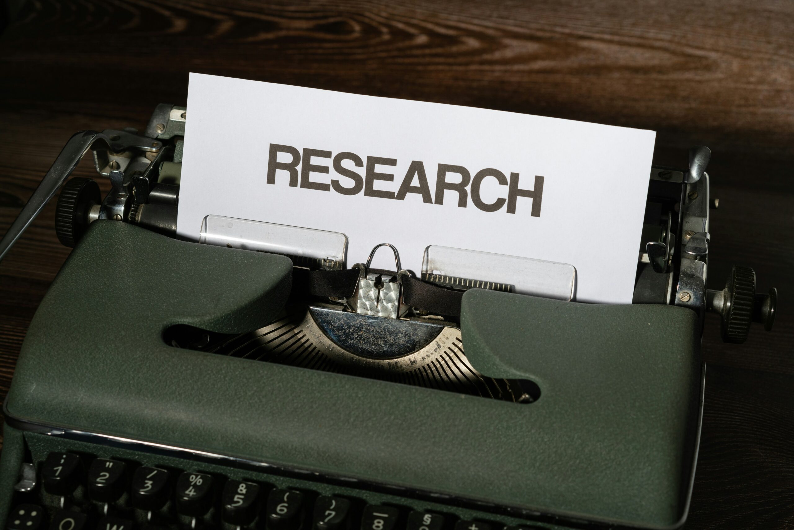Typewriter with the word RESEARCH printed on a page, perfect for app marketing research and ASO.
