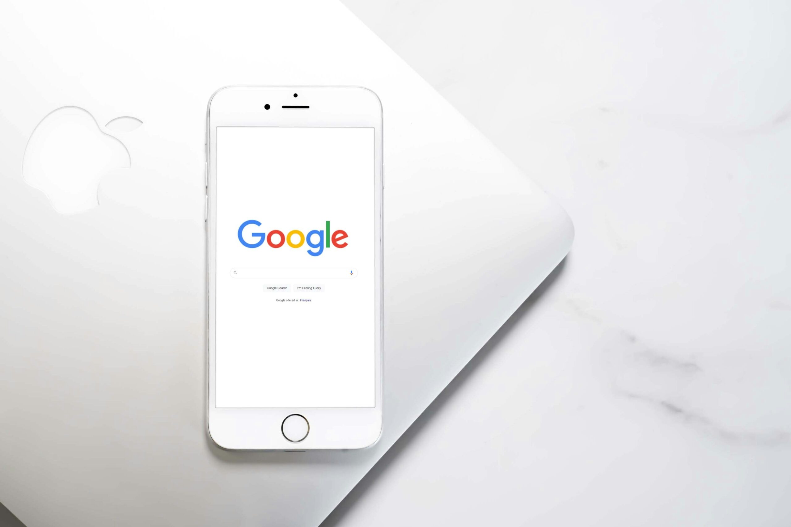Smartphone displaying Google search page. Google Ads, app marketing, and advertising.