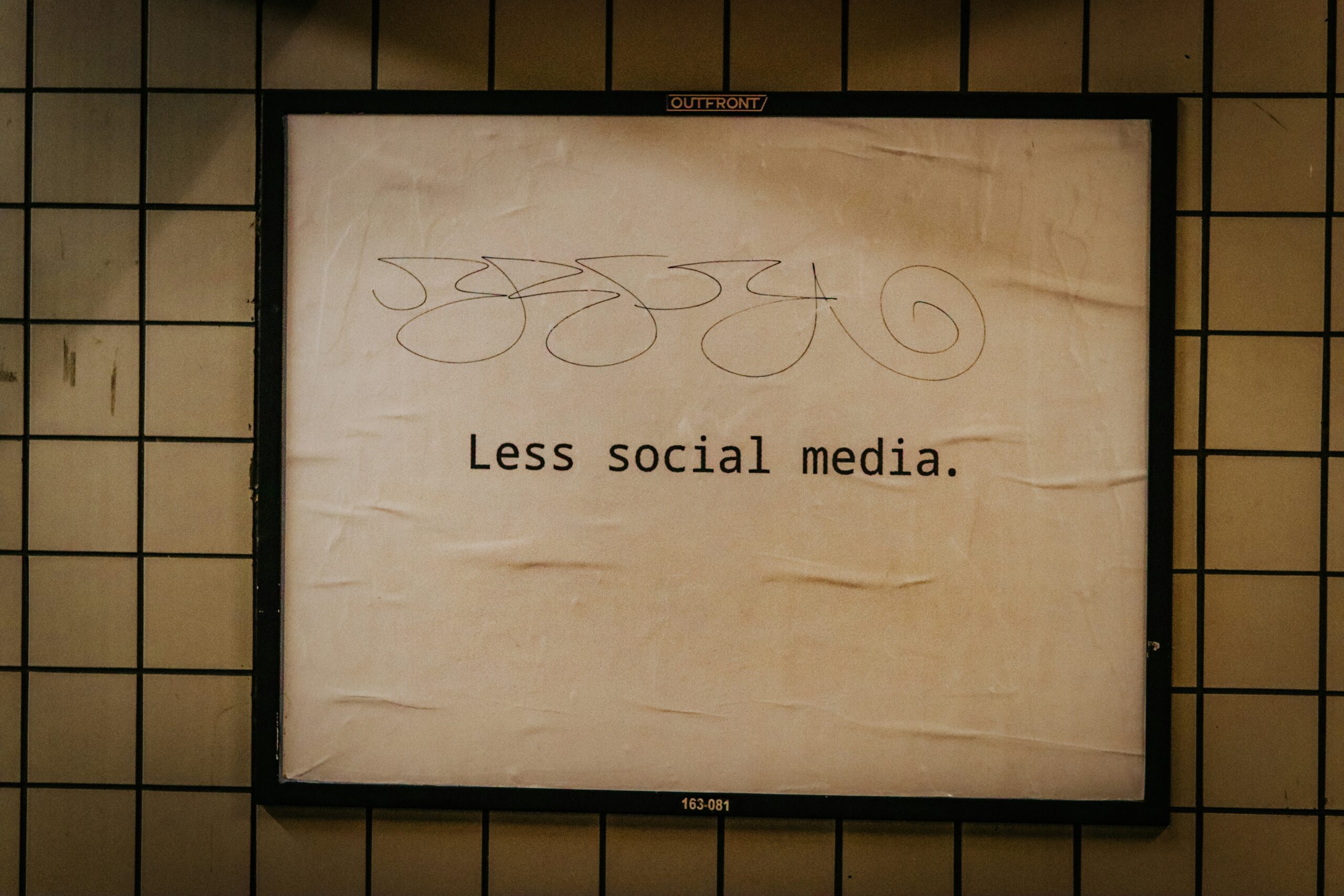 Poster with the message 'Less social media.'