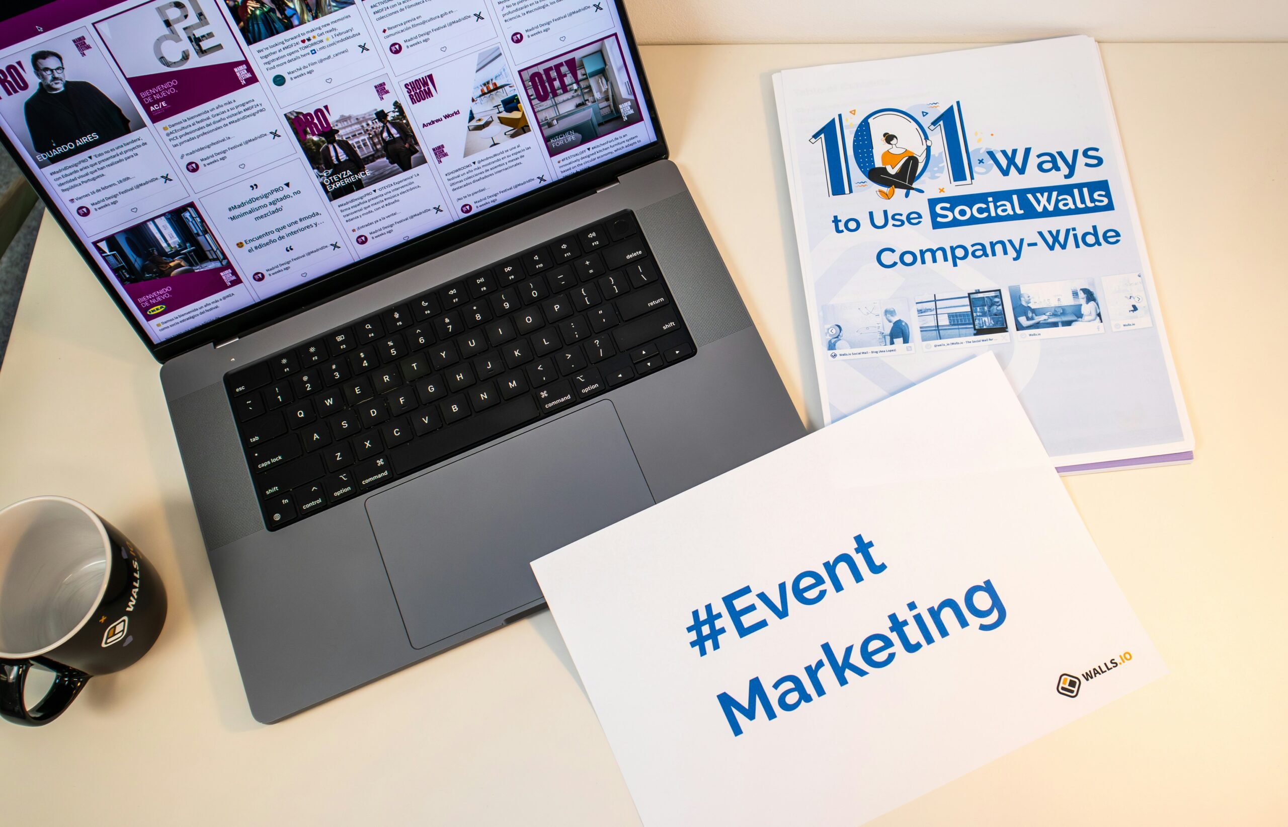 Laptop screen with social media marketing content and a sign saying #Event Marketing.