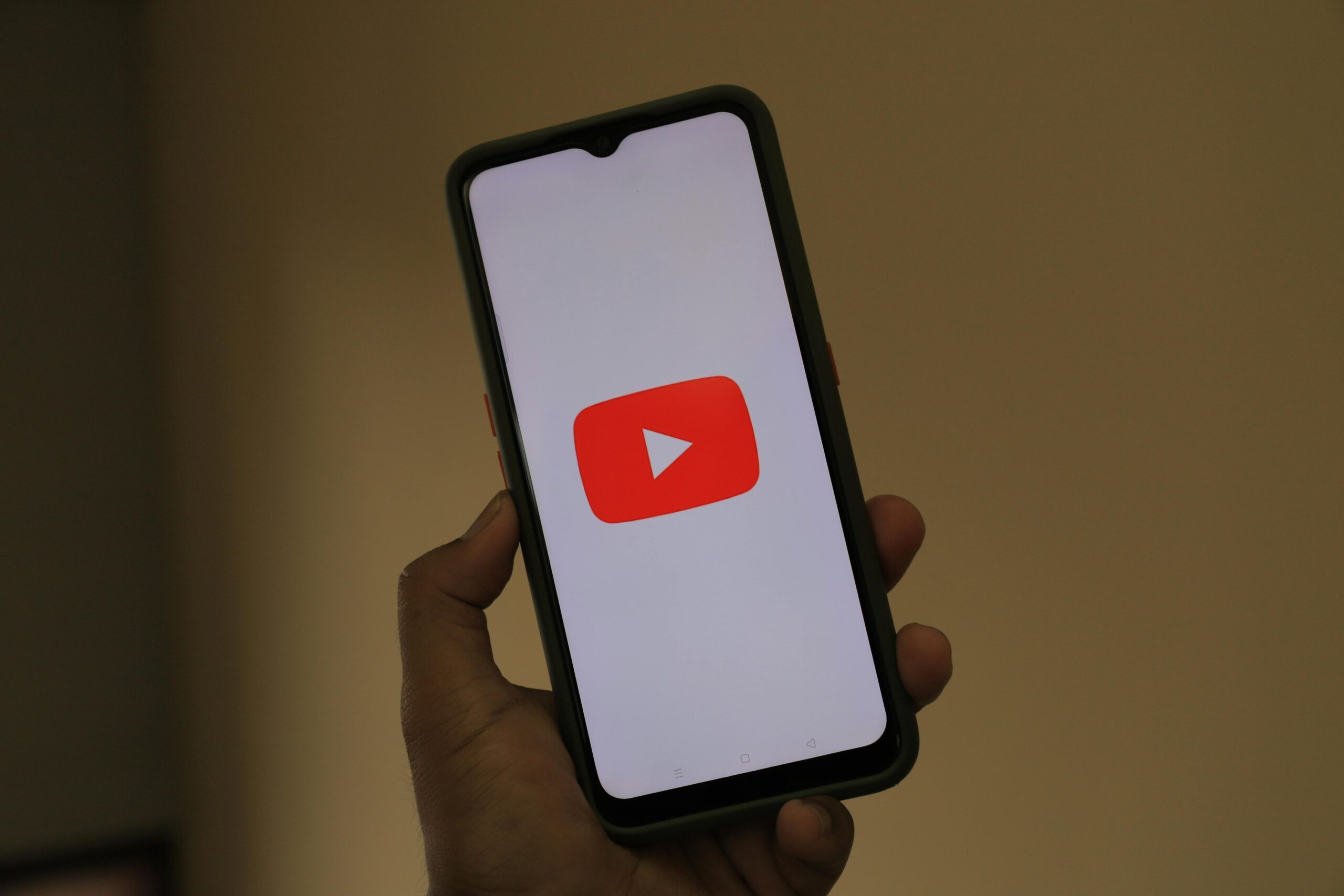 Smartphone displaying the YouTube app logo.