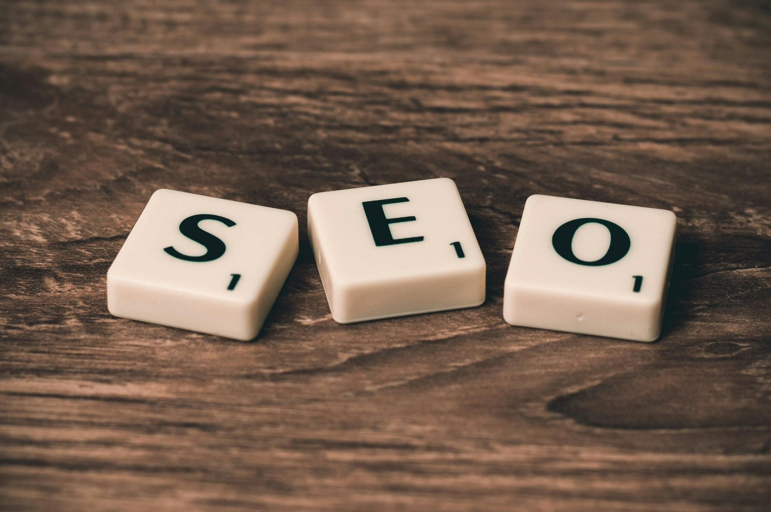 SEO letters on wooden surface, emphasizing marketing strategy.
