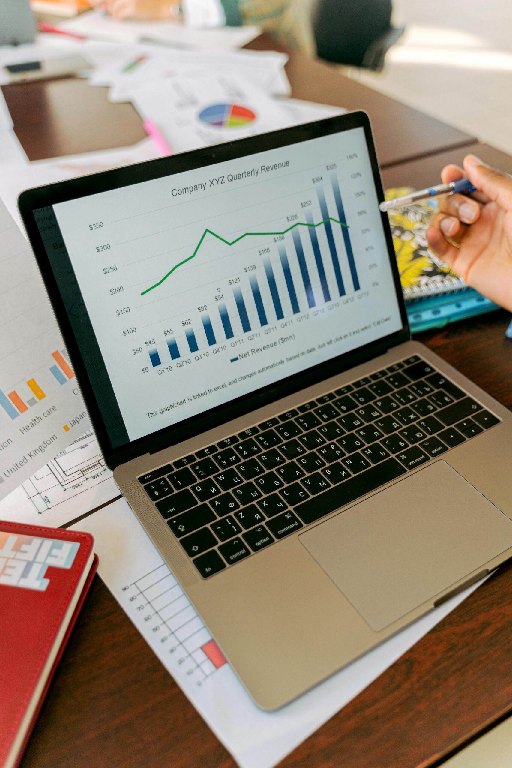 Laptop displaying a company's quarterly revenue graph.