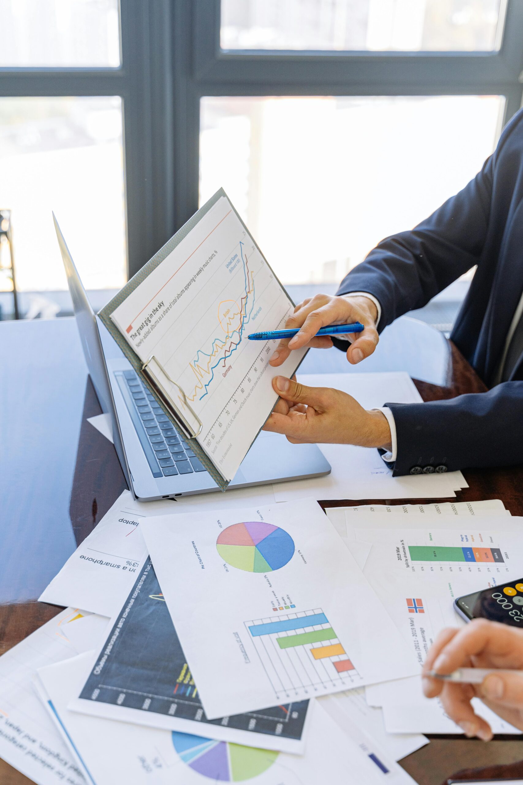 A person analyzing marketing data on a computer screen, with charts and graphs. The background should be a modern office environment, emphasizing the importance of data-driven decision-making.