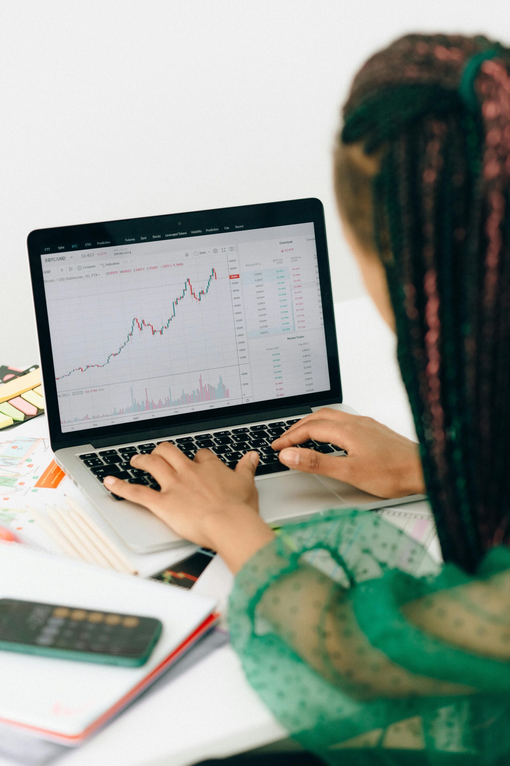 A marketer analyzing data on a computer screen, with charts and graphs representing website traffic, social media engagement, and conversion rates, with a focused expression and a modern office background.