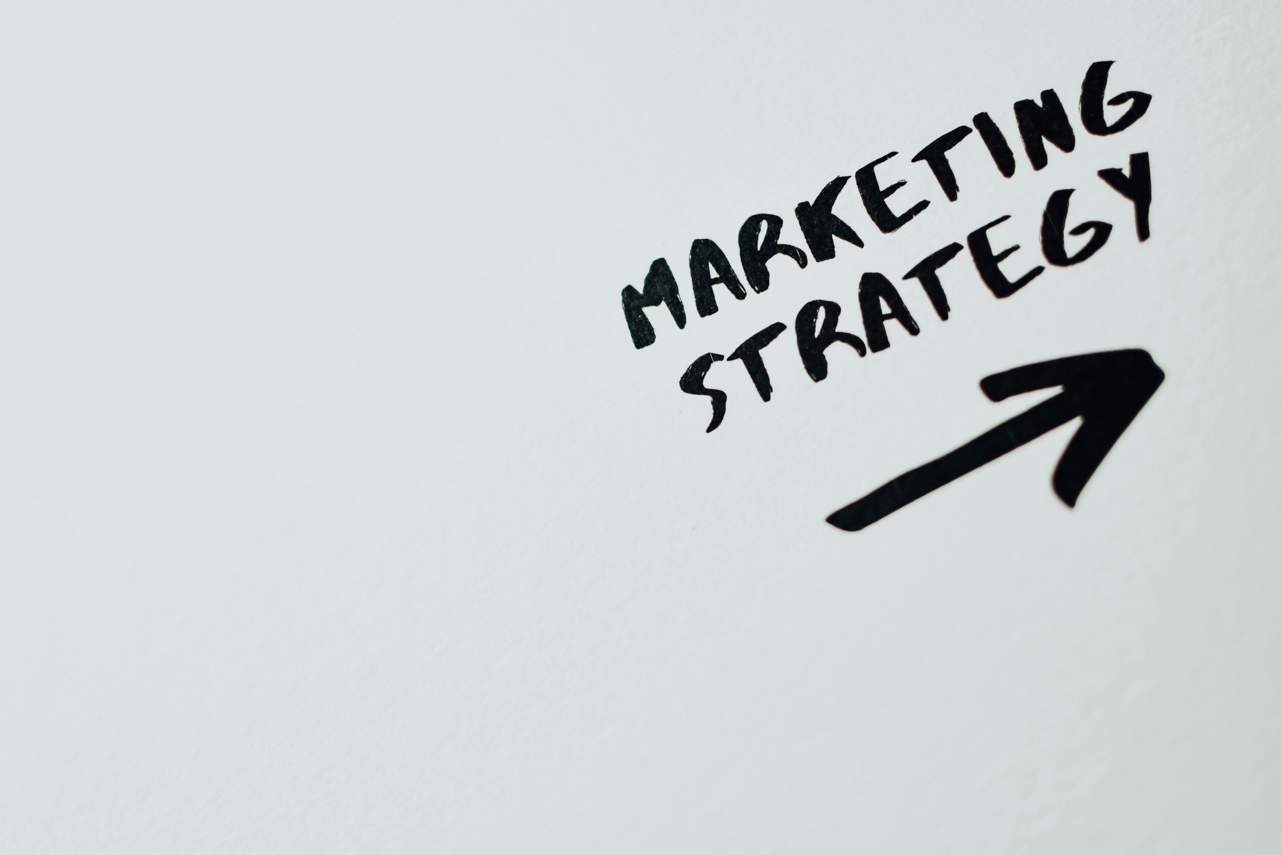 A successful brand logo shining on a digital screen, with a background of upward-trending graphs and positive indicators, illustrating growth and success, with a modern, clean design.