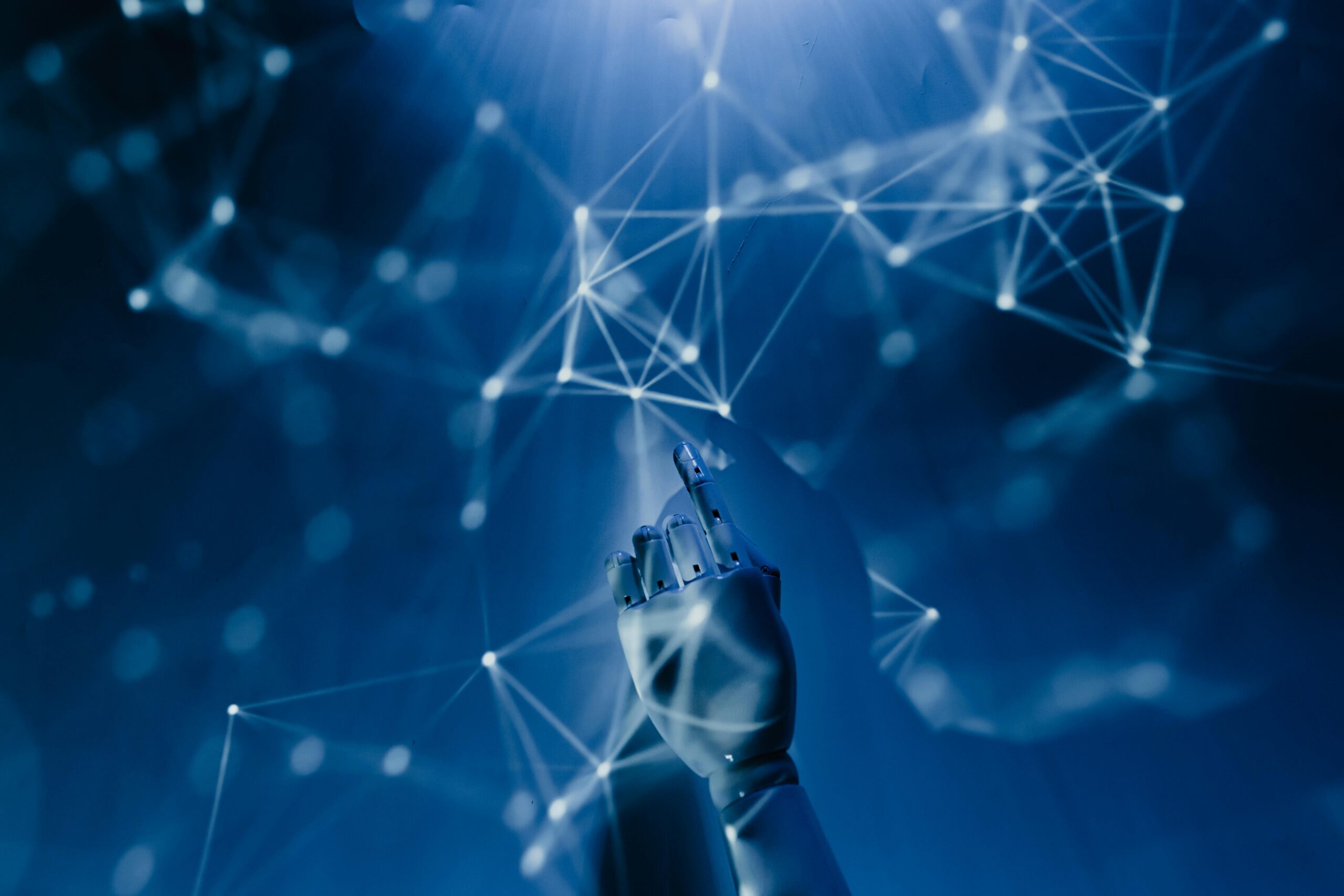 Robot hand pointing to a network. AI, machine learning, and automation concept.