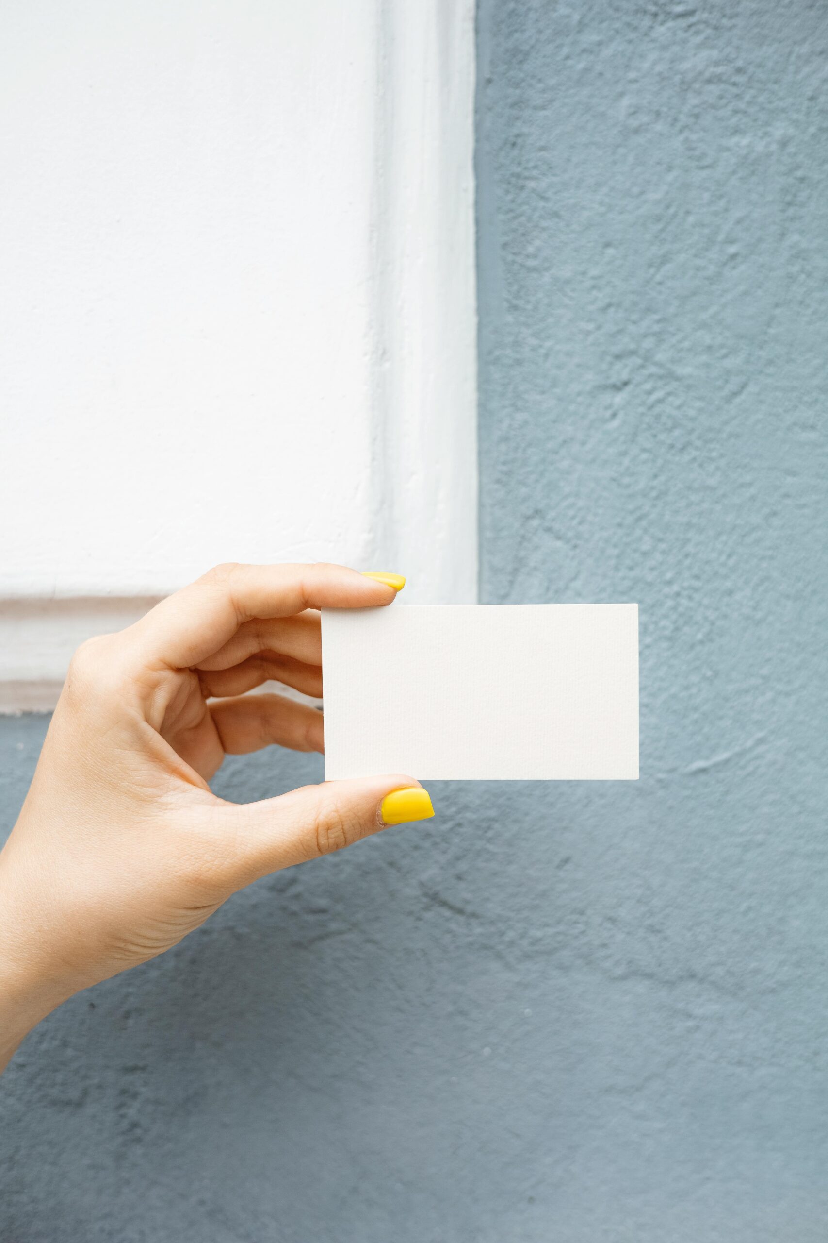 Person holding a blank business card. Space for your digital marketing information.