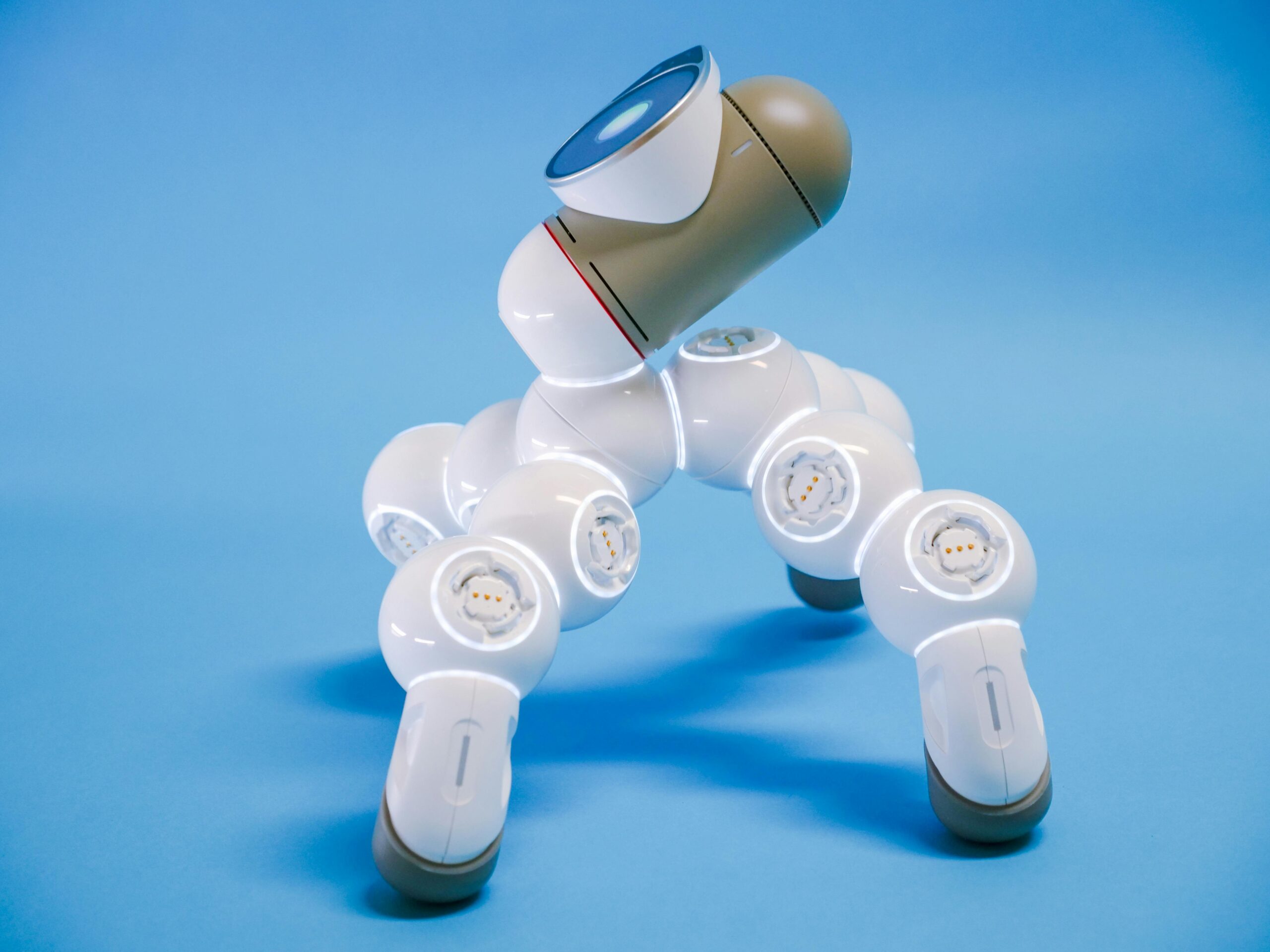 Abstract robotic structure with multiple joints, on a blue background.