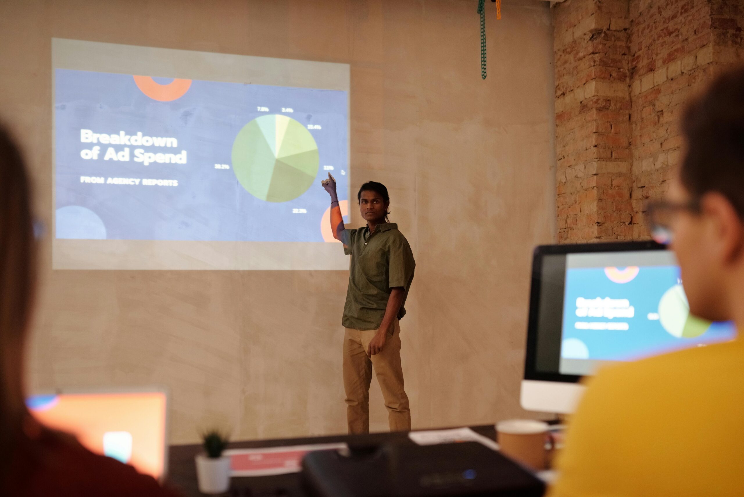 A person confidently analyzing Google Ads data on a laptop, with charts and graphs showing positive trends and ROI. The setting is a modern office in Texas, emphasizing a data-driven and professional approach.