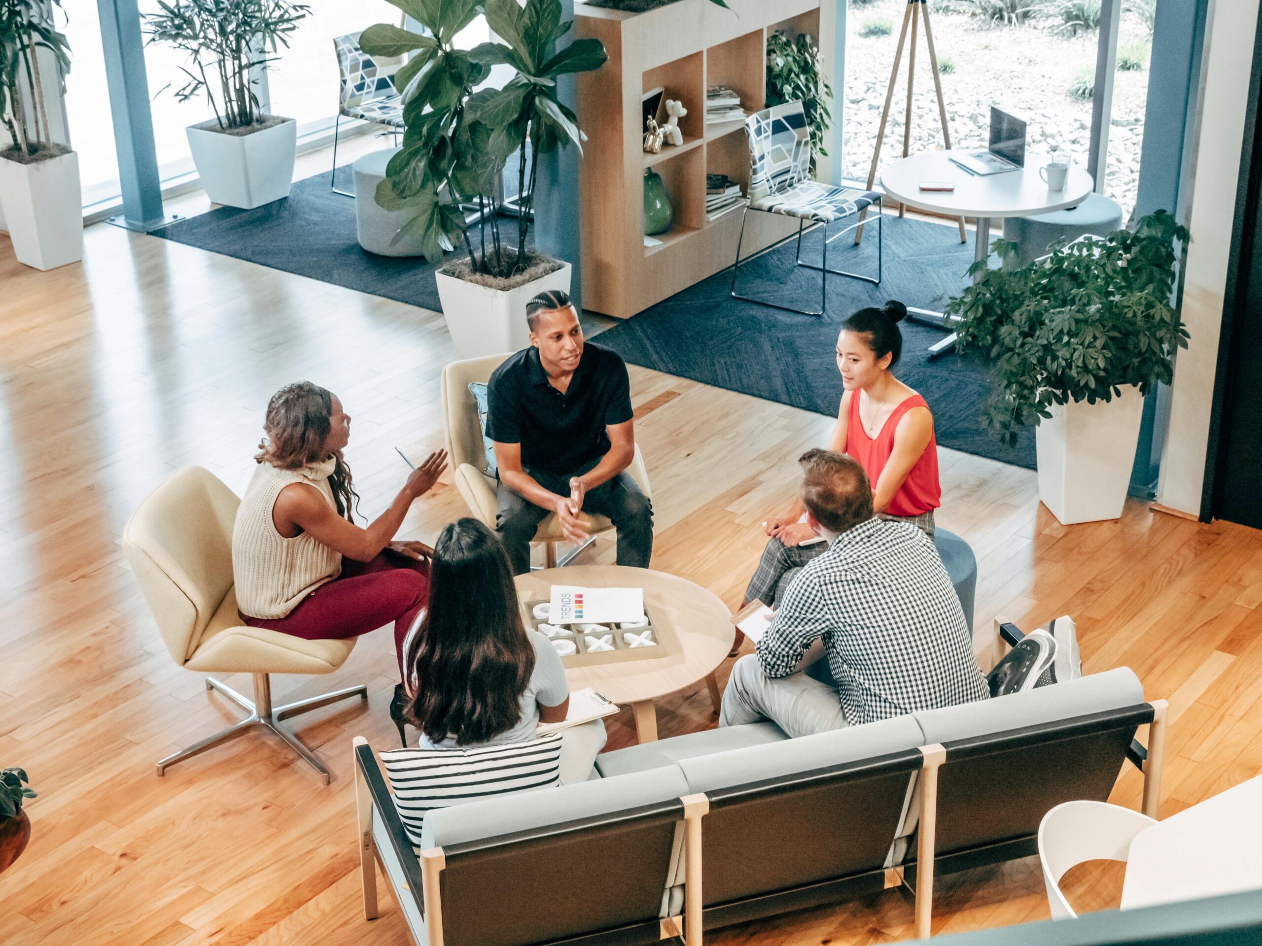 A concluding image that encapsulates the overall theme of personalized marketing, featuring a diverse group of happy customers interacting with a brand through various digital channels. Use warm, inviting colors and a sense of community to convey the positive impact of personalization.
