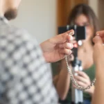 A diverse group of people interacting with digital devices, symbolizing a wide online audience.