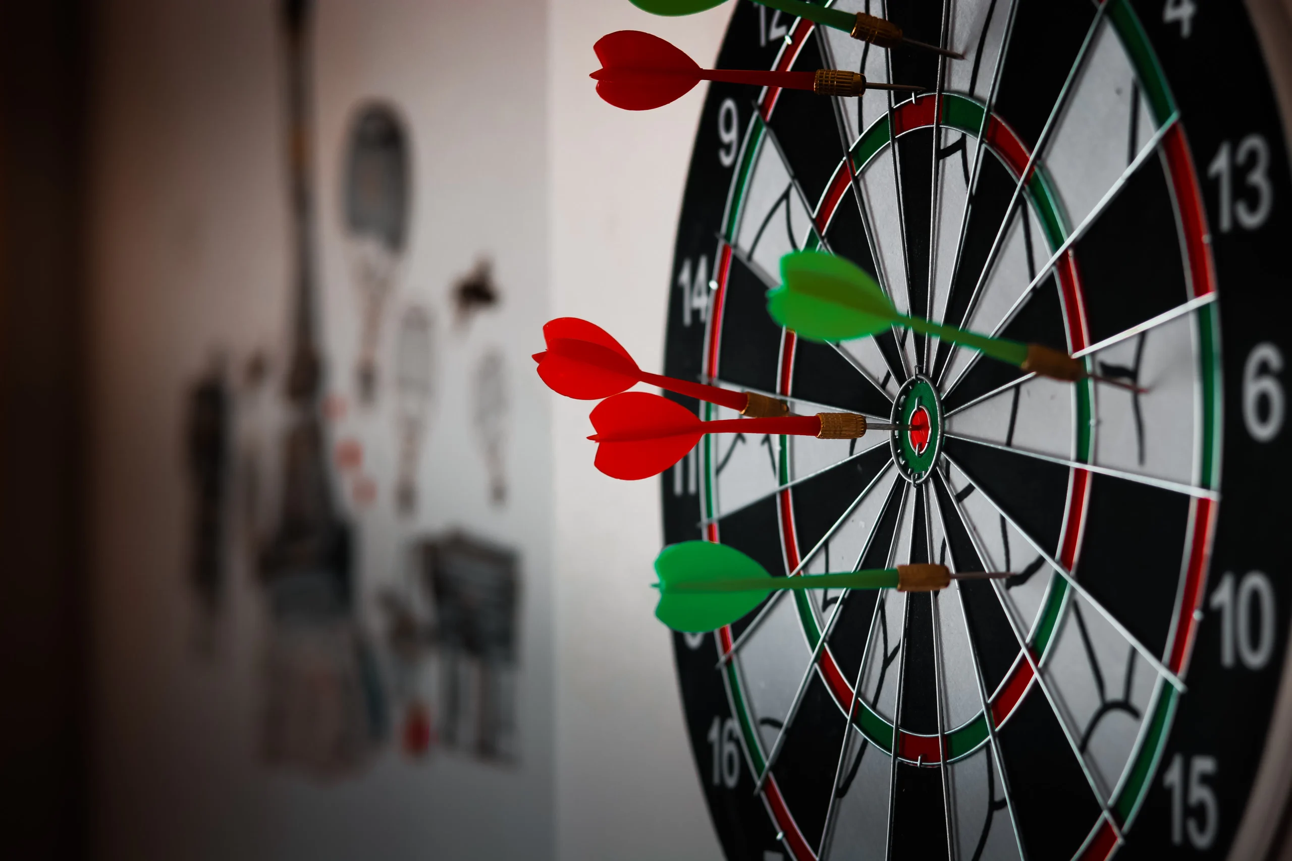 Close-up of a dartboard with darts hitting the bullseye, ideal for illustrating precision targeting in a native advertising agency or digital marketing agency campaign.