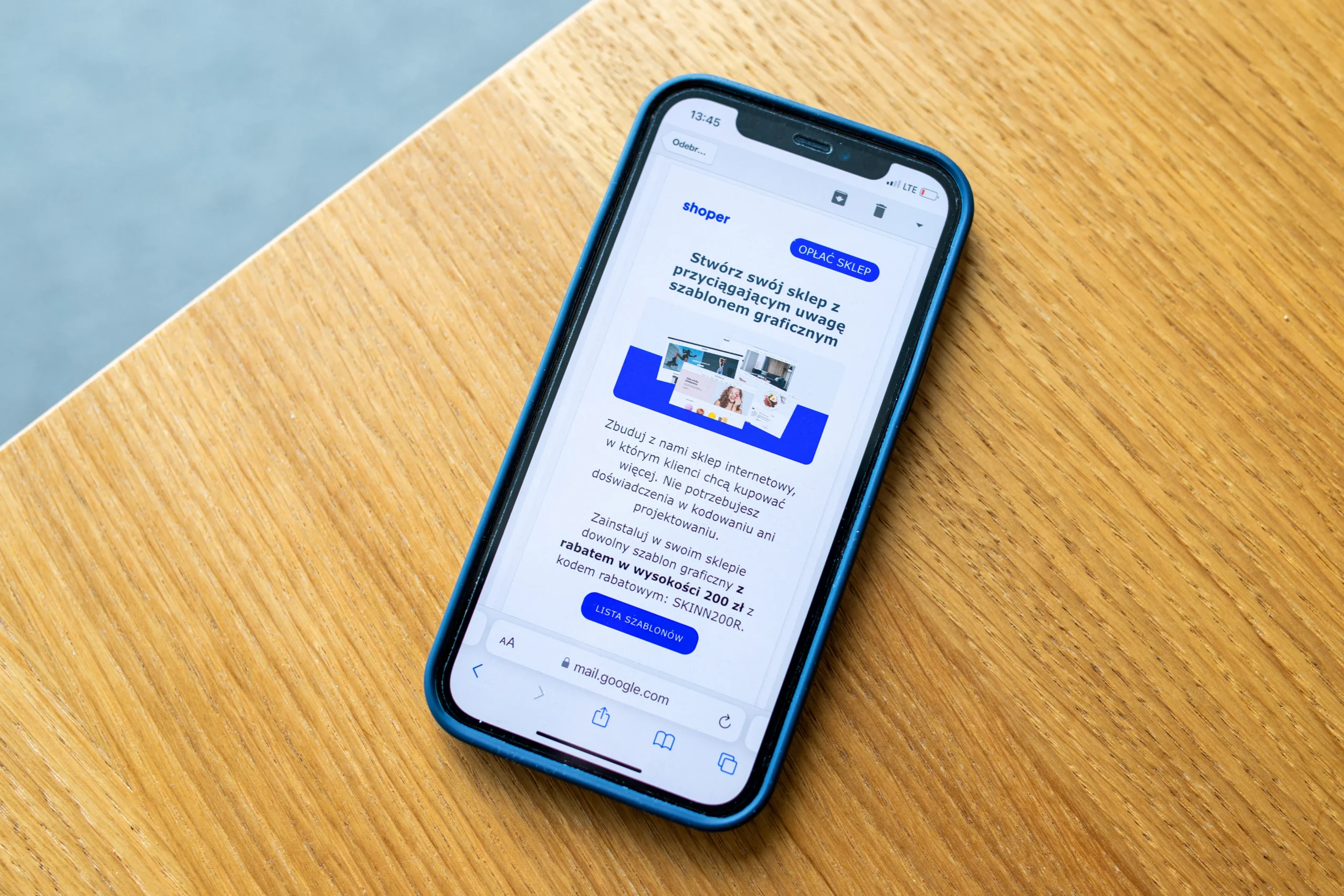 A smartphone displaying a Shoper app interface, showcasing its features for creating online stores with attention-grabbing graphics, representing mobile native ads for publishers.