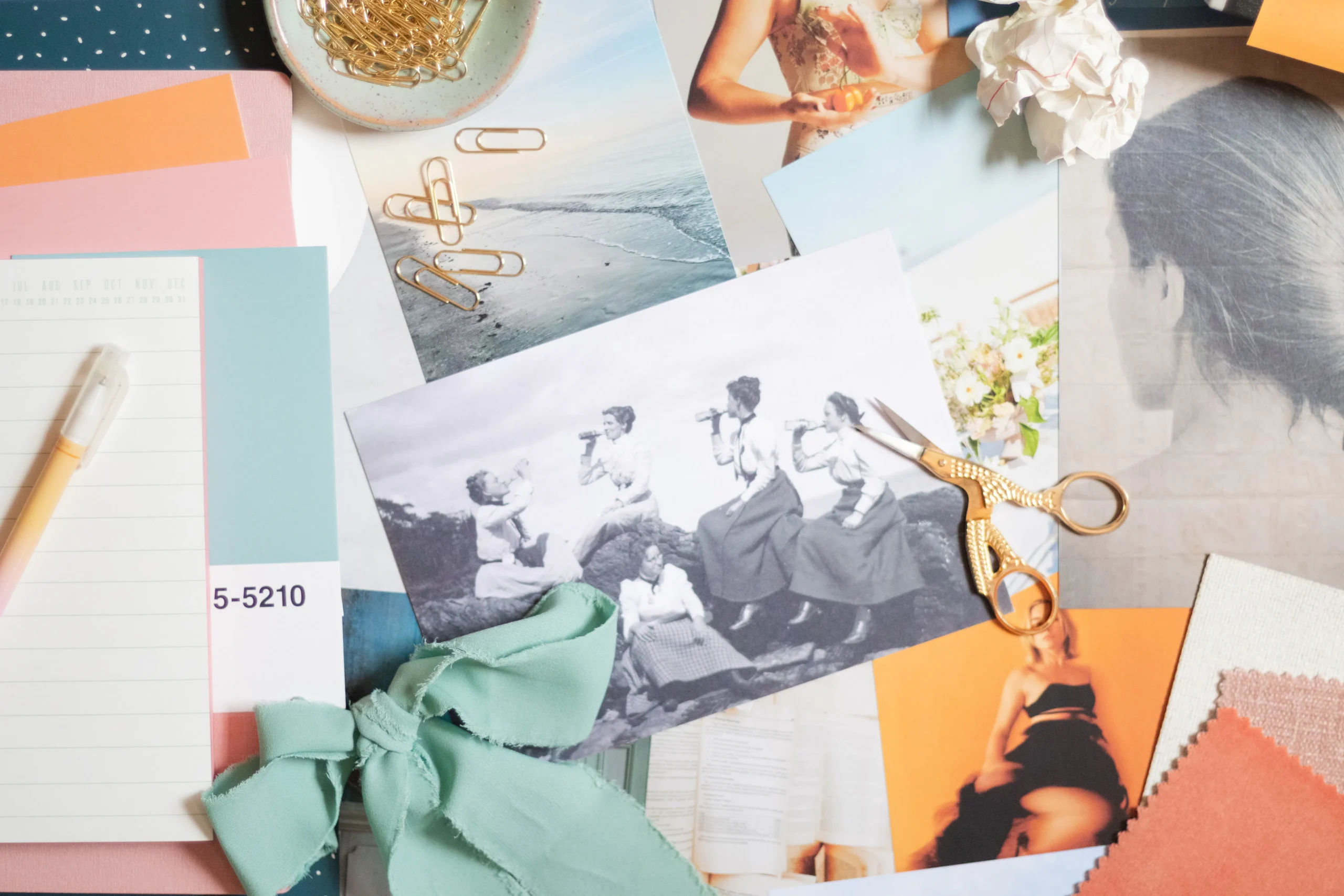 A creative mood board with various images, fabric swatches, and stationery, symbolizing the brainstorming process for developing engaging native advertising examples for Taboola.