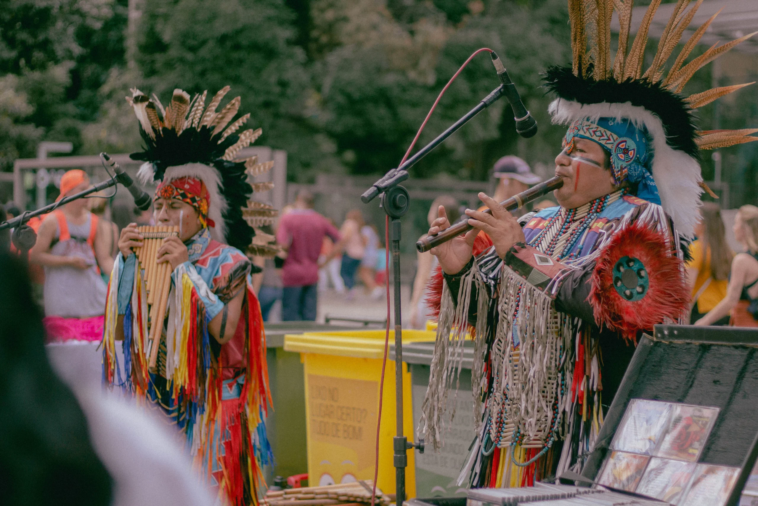 Indigenous musicians performing in traditional attire, offering a colorful visual metaphor for the diverse and culturally rich landscape where native advertising, like Taboola ads, seeks to connect with audiences in authentic ways.